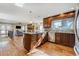 Spacious kitchen with island, stainless steel appliances, and hardwood floors at 7338 S Yukon Ct, Littleton, CO 80128