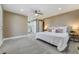 Spacious main bedroom with plush carpet and access to a balcony at 7338 S Yukon Ct, Littleton, CO 80128