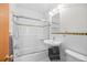 Clean bathroom with glass shower door, decorative tile, sink, and toilet at 1175 N Emerson St # 308, Denver, CO 80218
