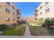 Charming courtyard between apartment buildings with a small garden and walking path at 1175 N Emerson St # 308, Denver, CO 80218
