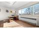 Bright home office space featuring hardwood floors, a large window, and a functional workspace at 1175 N Emerson St # 308, Denver, CO 80218
