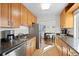 Galley kitchen with stainless steel appliances and natural light at 1175 N Emerson St # 308, Denver, CO 80218