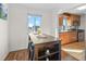 Eat-in kitchen area featuring a high-top table and a clear view into the kitchen at 1175 N Emerson St # 308, Denver, CO 80218