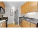 Efficient kitchen featuring stainless steel appliances and in-unit washer/dryer at 1175 N Emerson St # 308, Denver, CO 80218