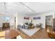 Bright living room featuring modern lighting, comfortable seating, and stylish decor on hardwood floors at 1175 N Emerson St # 308, Denver, CO 80218