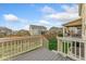 Backyard with a wooden deck, grass and privacy fence at 14278 Forest St, Thornton, CO 80602