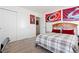 Cozy bedroom with closet, sports decor, and a comfortable bed at 14278 Forest St, Thornton, CO 80602