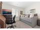Comfortable bedroom featuring neutral walls and carpet, a daybed, and a functional work space at 14278 Forest St, Thornton, CO 80602