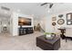 Upstairs bonus room featuring a large television, sitting area, and dining table set at 14278 Forest St, Thornton, CO 80602