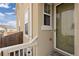 Exterior angle of a home featuring a frosted glass storm door and stylish siding at 14278 Forest St, Thornton, CO 80602