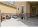 Inviting front porch with stone accents and cozy seating area at 14278 Forest St, Thornton, CO 80602