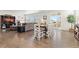 Spacious living area featuring hardwood floors, a fireplace, and sliding glass doors leading to a deck at 14278 Forest St, Thornton, CO 80602