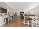 Open floor plan combining the kitchen, dining, and living area with hardwood floors at 14278 Forest St, Thornton, CO 80602