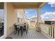 Relaxing covered patio with a table and chairs, perfect for outdoor dining and entertaining at 14278 Forest St, Thornton, CO 80602