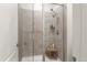 Modern shower with grey tile and a built in bench at 14278 Forest St, Thornton, CO 80602