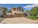 Charming two-story house featuring a brick-accented facade and a spacious driveway with RV parking behind a fence at 4203 E 126Th Ave, Thornton, CO 80241