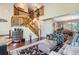 Elegant foyer featuring a grand staircase, hardwood floors, and an open layout into the living and dining areas at 4203 E 126Th Ave, Thornton, CO 80241