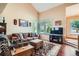 Cozy living room with ample natural light, plush seating, and stylish decor, perfect for relaxation at 4203 E 126Th Ave, Thornton, CO 80241
