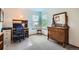 Bright home office with neutral carpet, wooden furniture, and a large window with backyard views at 4203 E 126Th Ave, Thornton, CO 80241