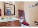Bathroom with a single sink and a decorative mirror at 4203 E 126Th Ave, Thornton, CO 80241