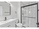 Modern bathroom featuring walk-in shower with glass door, floating vanity at 6800 E Tennessee Ave # 541, Denver, CO 80224