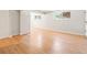 Bedroom showcasing laminate flooring, neutral walls and trim, and natural light from two windows at 6800 E Tennessee Ave # 541, Denver, CO 80224