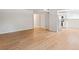 Spacious living room with sleek, light-toned laminate flooring and a neutral color palette at 6800 E Tennessee Ave # 541, Denver, CO 80224