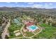 Overhead view of a neighborhood with pool, tennis courts, and playground at 11771 Elk Head Range Rd, Littleton, CO 80127