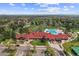 Aerial view of community clubhouse with pool and landscaped grounds at 11771 Elk Head Range Rd, Littleton, CO 80127