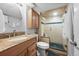 Bathroom with glass enclosed shower, vanity, and tile at 11771 Elk Head Range Rd, Littleton, CO 80127