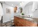 Updated bathroom features a double vanity with granite countertop and stylish fixtures at 11771 Elk Head Range Rd, Littleton, CO 80127