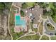 Aerial shot of a community pool area with a large pool, splash pad, and walkways, enhancing community appeal at 11771 Elk Head Range Rd, Littleton, CO 80127