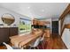 Dining room with wood floors, bright natural light, and an open concept design with the kitchen at 11771 Elk Head Range Rd, Littleton, CO 80127