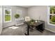 Bright office space featuring a modern desk, a comfortable chair, and natural light at 11771 Elk Head Range Rd, Littleton, CO 80127