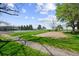 Scenic view of neighborhood park with playground, tennis courts, and trees at 11771 Elk Head Range Rd, Littleton, CO 80127