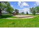 Neighborhood park with playground and swings set among the trees and grass at 11771 Elk Head Range Rd, Littleton, CO 80127