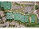 Aerial view showcasing multiple well-maintained tennis courts with parking, perfect for recreational activities at 11771 Elk Head Range Rd, Littleton, CO 80127