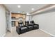 Finished basement with kitchenette and theater chairs at 11771 Elk Head Range Rd, Littleton, CO 80127