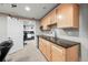 Finished basement with kitchenette and light wood cabinets at 11771 Elk Head Range Rd, Littleton, CO 80127