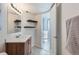 Bathroom features single sink vanity and floating shelves at 12338 W Dorado Pl # 107, Littleton, CO 80127
