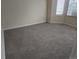 Bedroom features neutral carpet and ample natural light at 12338 W Dorado Pl # 107, Littleton, CO 80127