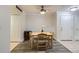 Inviting dining room featuring a wooden table, four chairs, and stylish flooring for comfortable gatherings at 12338 W Dorado Pl # 107, Littleton, CO 80127