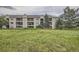 Exterior of building with lawn and greenery in foreground at 12338 W Dorado Pl # 107, Littleton, CO 80127