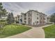 Exterior view of multi-story building with stone and siding at 12338 W Dorado Pl # 107, Littleton, CO 80127