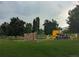 Community playground with a climbing wall and slide for active outdoor fun at 12338 W Dorado Pl # 107, Littleton, CO 80127
