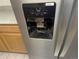 Close-up of the water and ice dispenser, featuring a modern design and easy-to-use controls at 12338 W Dorado Pl # 107, Littleton, CO 80127