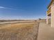 Spacious backyard with a view of the surrounding landscape on a sunny day at 14855 Almstead St, Hudson, CO 80642