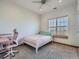 Bedroom featuring neutral colored walls, window and modern ceiling fan at 14855 Almstead St, Hudson, CO 80642