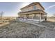 Stunning two-story home with a spacious yard and inviting porch, perfect for outdoor entertaining and Gathering gatherings at 14855 Almstead St, Hudson, CO 80642