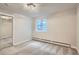 Bright bedroom with neutral paint, large window and closet with mirrored doors at 336 N Grant St # 412, Denver, CO 80203